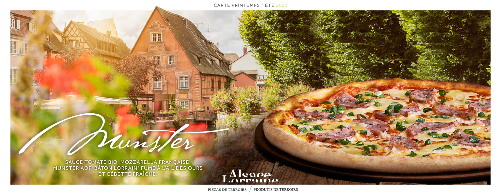 Pizza Munster des restaurants Basilic & Co, avec un village Alsacien en arrière-plan